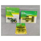 Three John Deere toys small