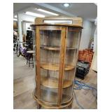 Curved front curio cabinet 62X31X 13.  4 shelves
