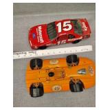 Plastic orange car and metal NASCAR