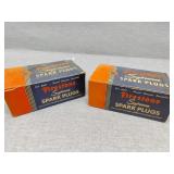 Two full boxes Firestone spark plugs