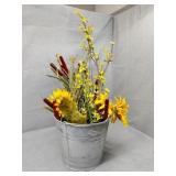 Tin pail and fake flowers