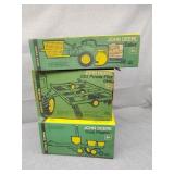 Three empty John Deere boxes