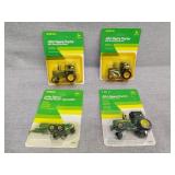 4 small John Deere toys