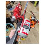 Three fishing poles with reels