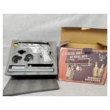 Pistol shaped decanter with two glasses