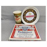 Plastic Budweiser coin bank, server and puzzle