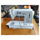 Sewing table with machine