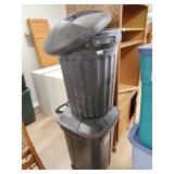 Two plastic trash cans