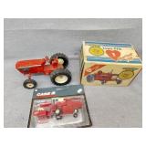 Empty Farmall box, case combine and red tractor