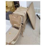 Eight folding chairs and card table