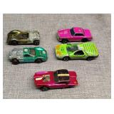 Five red line Hot Wheels one missing rear wheels