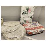 Eight round chair cushions and two blankets
