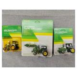Three John Deere tractors