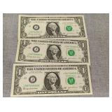 Three consecutive 2003 dollar bills