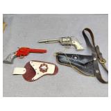 Two toy guns and holsters
