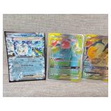 Three pokï¿½mon trading cards