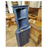 Two small corner cabinets