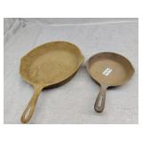 Two cast pans