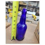 11 blue bottles with pop-on lids