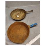 Two cast pans