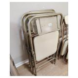 Four folding chairs not all same color