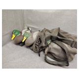 Four floating duct decoys with Cabela's mesh bag