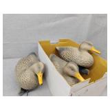 Three floating duck decoys