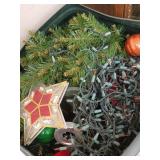 Trash can packed full of Christmas