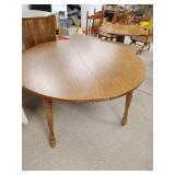 Wood table 48-in dia includes two leaves see