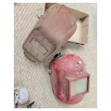 Two older welding helmets