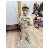Plaster John Deere boy figure missing one wheel