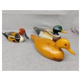 Three ducks two fronts , wood back one is ceramic