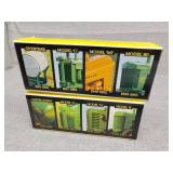 2 - sets of four small display tractors