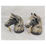 Two metal horse pole toppers