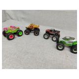 4 plastic monster trucks