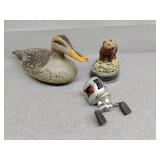 Plastic duck, fishing reel and bear decor