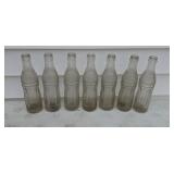 Seven old Dr Pepper soda bottles Paris Illinois