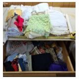 Contents of fabric in shelf and on top of shelf