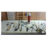 Thermos, kitchen and grill utensils and old scale