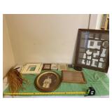 Box full of picture frames, mattes and chili wall