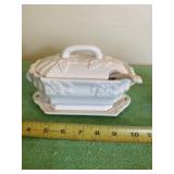 White ceramic soup tureen with spoon
