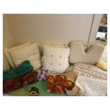 Pillows, rug and  blankets