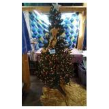 Christmas tree, tree skirt, star,and ornaments in
