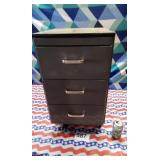 Small metal cabinet on wheels