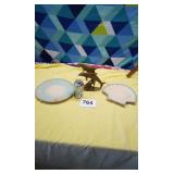 Metal dolphins and decorative shell plates