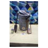 5 gallon water jugs ,small shovel and hacksaw