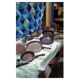 Assortment of skillets and 2 glass lids