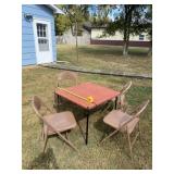 Card table and four aluminum chairs