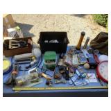 Flashlights, clock, tool bag, tent stakes and