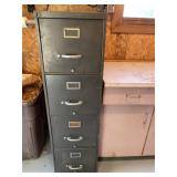Four drawer steel filing cabinet with contents